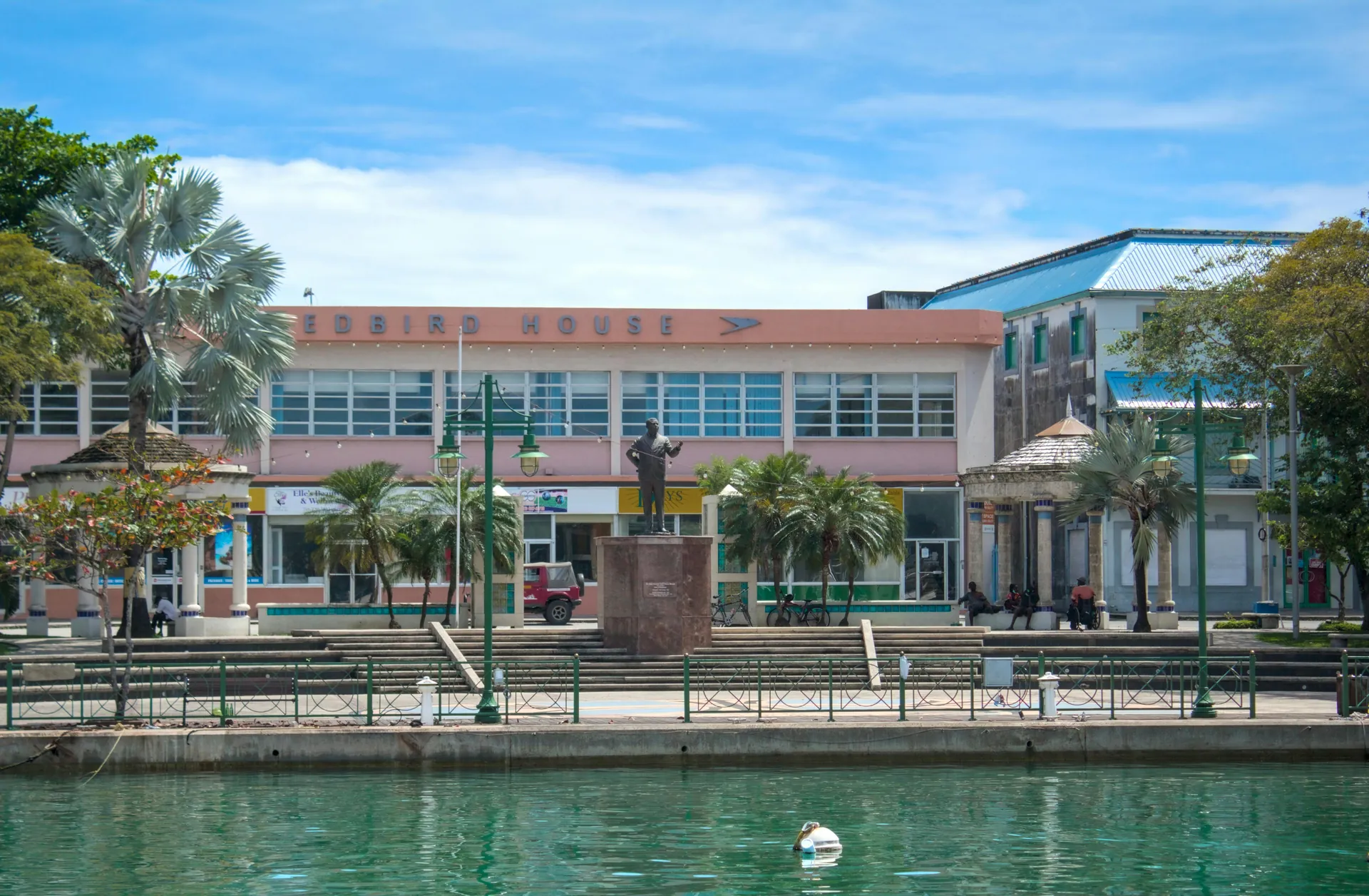 Downtown Bridgetown waterfront with iconic architecture on a sunny day.